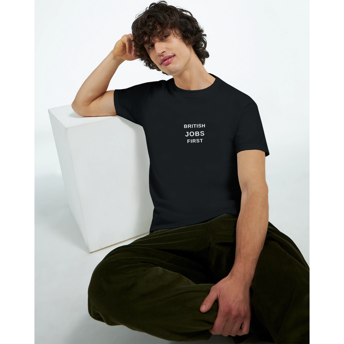 Model wearing the British Jobs First slogan T-shirt in black, front