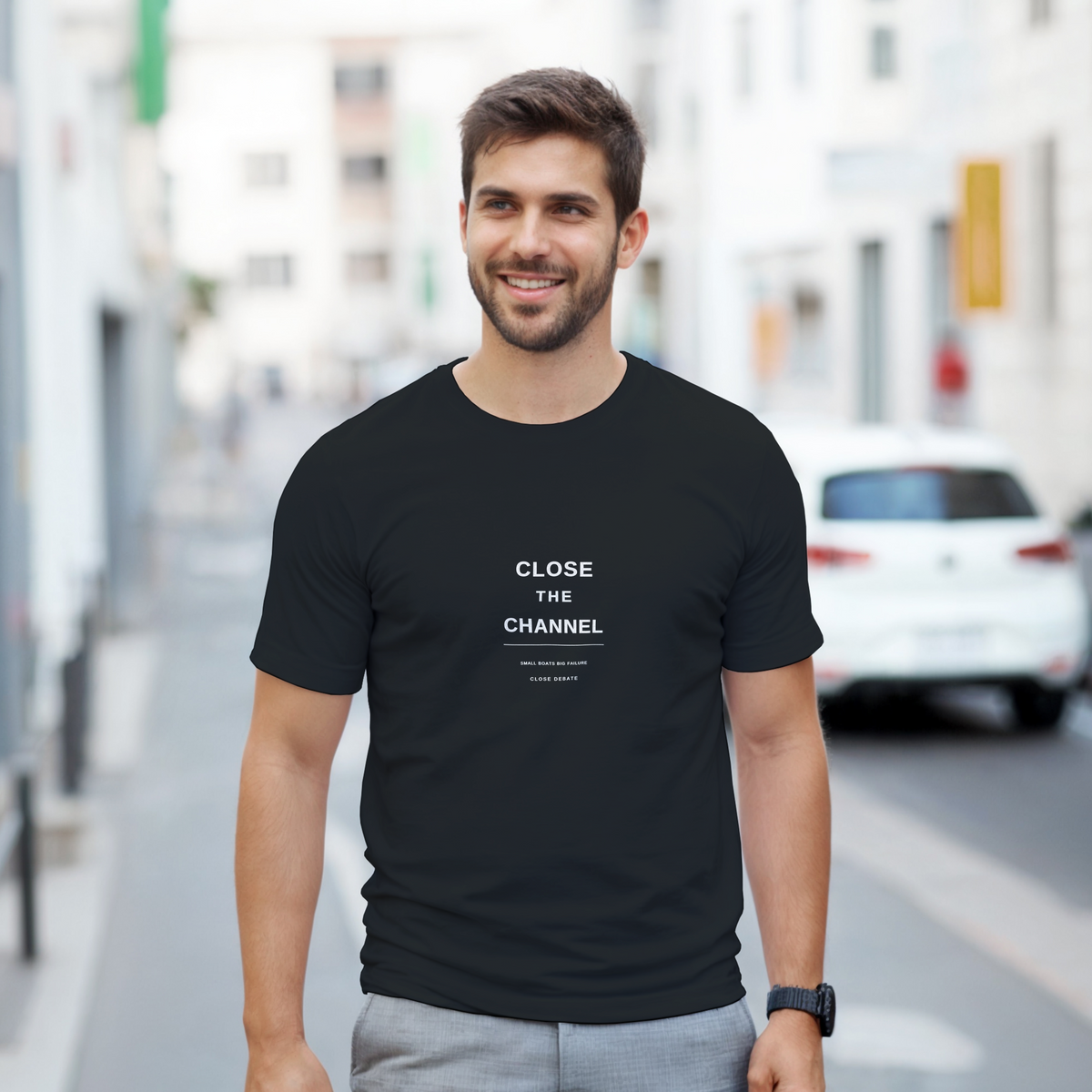 Model wearing the Close The Channel slogan T-shirt in black, front